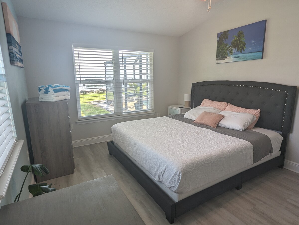 Second bedroom with king bed and water views