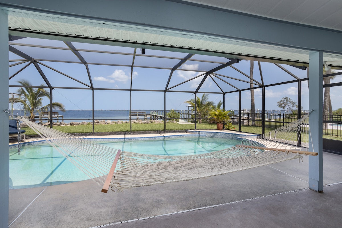 Hammock beside the screened pool with the river beyond